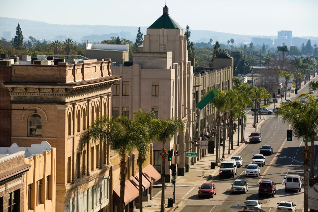 An aerial view of a busy street cutting through Downtown Santa Ana.